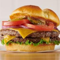 Famous Double Burger · Two patties, two slices of melted cheddar cheese, lettuce, tomatoes, red onions, and pickles...