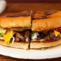 Regular Torta · Mexican sandwich with any meat, sour cream, American cheese, avocado, onions, tomatoes and l...
