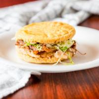 Gordita · Fried tortilla sandwich with any meat, refried beans, lettuce, sour cream, and feta cheese
