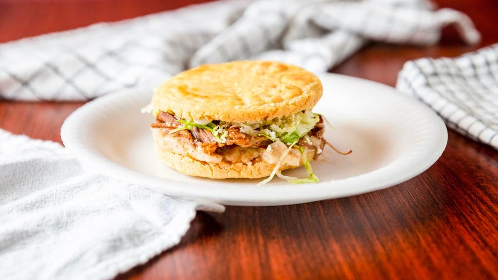 Gordita · Fried tortilla sandwich with any meat, refried beans, lettuce, sour cream, and feta cheese