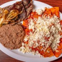 Rojo Con Asada Chilaquiles Plate · Fried tortilla breakfast plate, mild red sauce with 1 steak asada