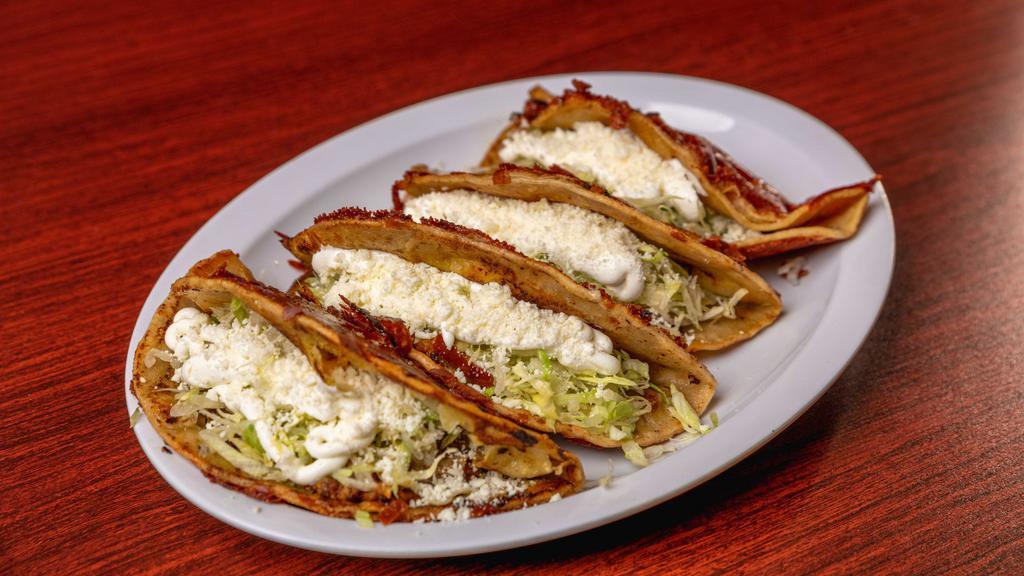 Tacos Quesadilla · Four crunchy burnt cheese tacos with potatoes, chorizo, lettuce, sour cream and cheese