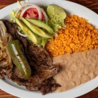 Carne Asada Plato · Three asada steaks, small salad, grilled onions and grilled jalapeno, with rice and beans