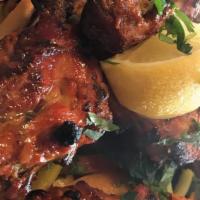Chicken Tikka Kebab (Breast Meat) · Boneless chicken marinated in mustard sauce with yogurt and spices. Cooked in tandoor.