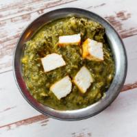 Palak Paneer · Chunks of homemade cheese cooked with fresh spinach, herbs and spices.