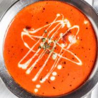 Chicken Makhani · Charcoal roasted free range boneless chicken cooked with butter, herbs and spices in a speci...