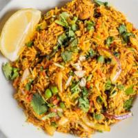 Chicken Biryani · Basmati rice cooked with free range chicken and spices.
