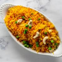 Saffron Rice · Saffron rice with green peas and cashews.