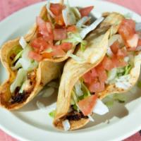 Gringo Taco · Hardshell corn tortilla, shredded beef or chicken, cheese, onions, chipotle cream, lettuce, ...