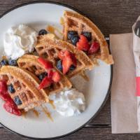 Churro Waffle · Classic Belgium waffle turned into a churro delight! Topped with fresh strawberries, blueber...