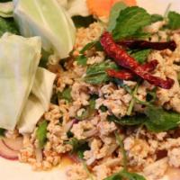 Larb Salad · Ground pork or chicken with red onion, rice powder, lime juice, chili and cilantro. Served w...
