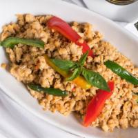 Pad Ka Paow Over Rice · Choice of ground pork, chicken or beef stir-fried with rice, chili and basil leaves.