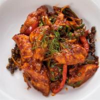 Fish Curry · Fresh or deep-fried catfish sautéed in a spicy curry paste with fresh chili and basil leaves.