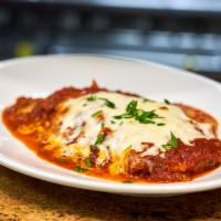 Pollo Parmigiana · Breaded chicken baked in marinara sauce and topped with mozzarella cheese.