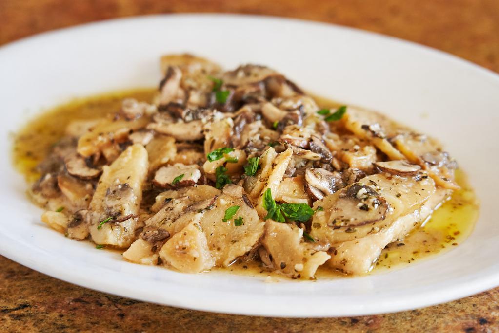 Pollo Al Vesuvio · Chicken breast with mushrooms, garlic, wine and sliced potatoes.