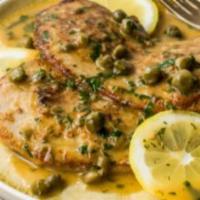 Veal Piccata · Veal with lemon, mushrooms, capers and garlic sautéed in white wine.