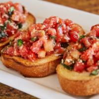 Small Bruschetta · Fresh cold tomatoes, basil and cheese on sliced baked bread. (4 Pieces)
