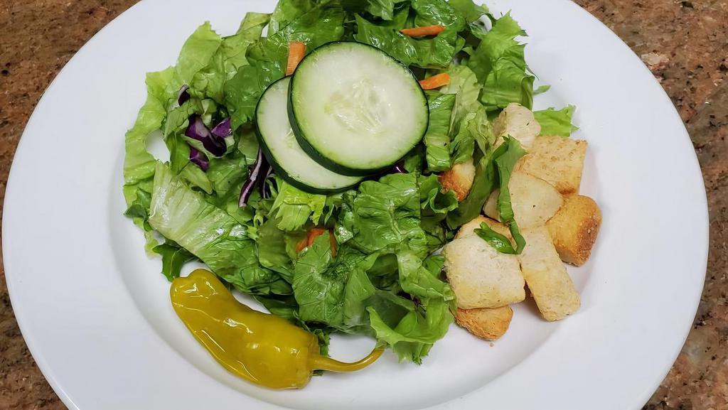 House Salad · Served with your choice of bleu cheese, Italian, ranch or our house dressing.