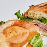 Italian Combo Sandwich · With mortadella, salami, ham, copa, provolone, lettuce and tomatoes.
Sandwiches served until...