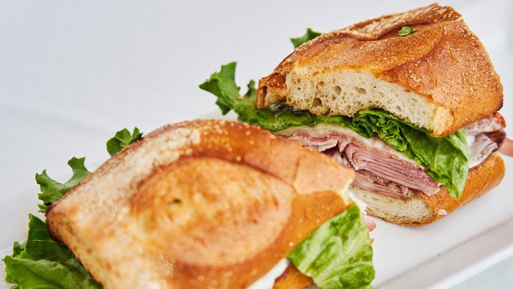 Italian Combo Sandwich · With mortadella, salami, ham, copa, provolone, lettuce and tomatoes.
Sandwiches served until 3 pm Tuesday through Saturdays