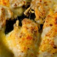 Pollo Florentina · A chicken breast folded with spinach in a white cream sauce.
