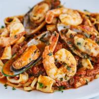 Linguini Alla Italiana · Shrimp, squid and mussels in a marinara garlic sauce.