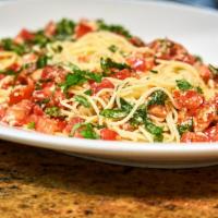 Spaghetti Di Campagnia · Spaghetti tossed with olive oil, fresh raw tomatoes, garlic, basil, and parmesan cheese. Tom...