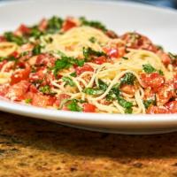 Spaghetti Di Campagnia · Served chilled with fresh tomatoes, garlic, basil, olive oil and parmesan cheese.