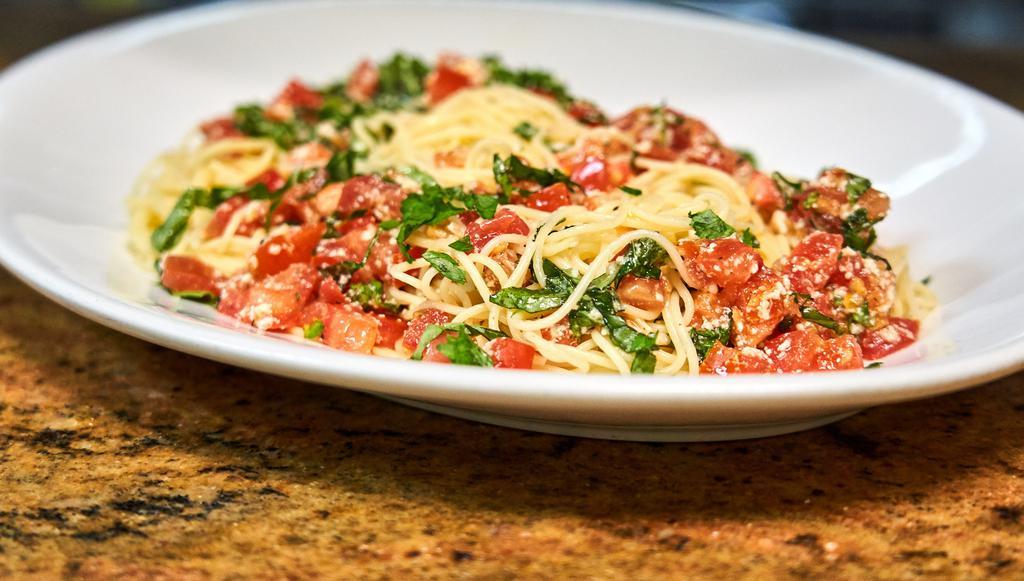 Spaghetti Di Campagnia · Served chilled with fresh tomatoes, garlic, basil, olive oil and parmesan cheese.