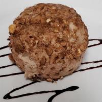 Tortuffo (Truffle) · Ice cream truffle.
Hazelnut, chocolate and lemoncello flavors are available.
(Hazelnut shown...