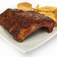 Bbq Style Ribs Dinner · 12 oz. BBQ pork ribs. Served with potato wedges, roll, and salad.