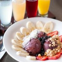 Acai Bowl · Acai berry sorbet topped with fresh strawberries, blueberries, bananas, granola, shredded co...