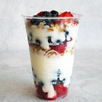 Berry Yogurt Parfait · Low-fat vanilla yogurt layered with granola, strawberries and blueberries.