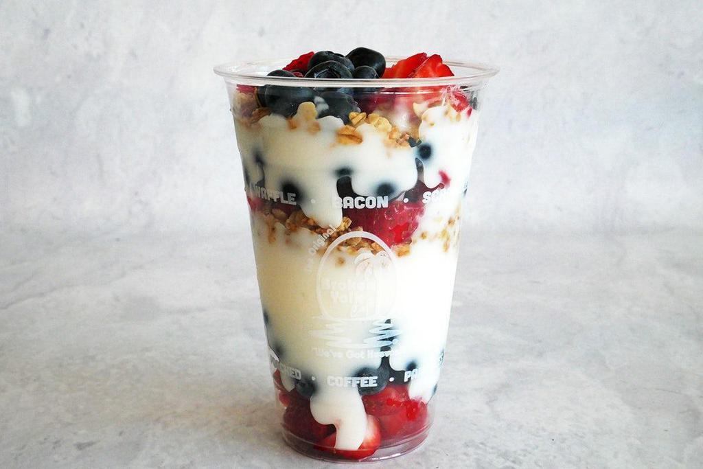 Berry Yogurt Parfait · Low-fat vanilla yogurt layered with granola, strawberries and blueberries.