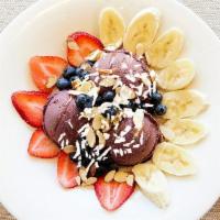 *New* Vegan Acai Bowl · Acai berry sorbet topped with fresh strawberries, blueberries, bananas, sliced almonds, shre...