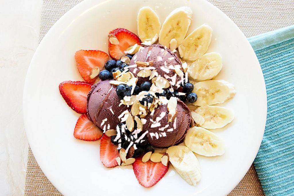 *New* Vegan Acai Bowl · Acai berry sorbet topped with fresh strawberries, blueberries, bananas, sliced almonds, shredded coconut, and agave syrup.