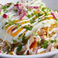 Chilaquiles Bowl · Corn tortilla chips, red or green sauce, Jack cheese, shredded chicken, sunny side up eggs, ...
