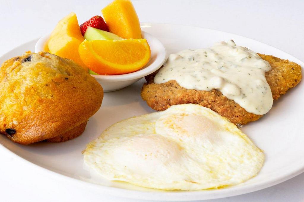 Chicken Fried Steak & Eggs · Beef Patty, breaded and fried like chicken, smothered in Country Gravy and served with your choice of eggs, side and bread.