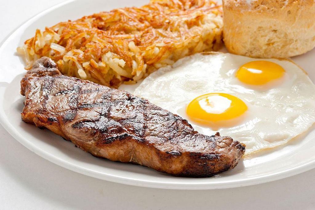 New York Steak & Eggs · 8oz New York Steak cooked to order and served with eggs, your choice of side and bread.