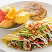 The Mom Omelet · Spinach, mushroom, onion, red and green bell pepper.  Topped with avocado, salsa fresca and ...