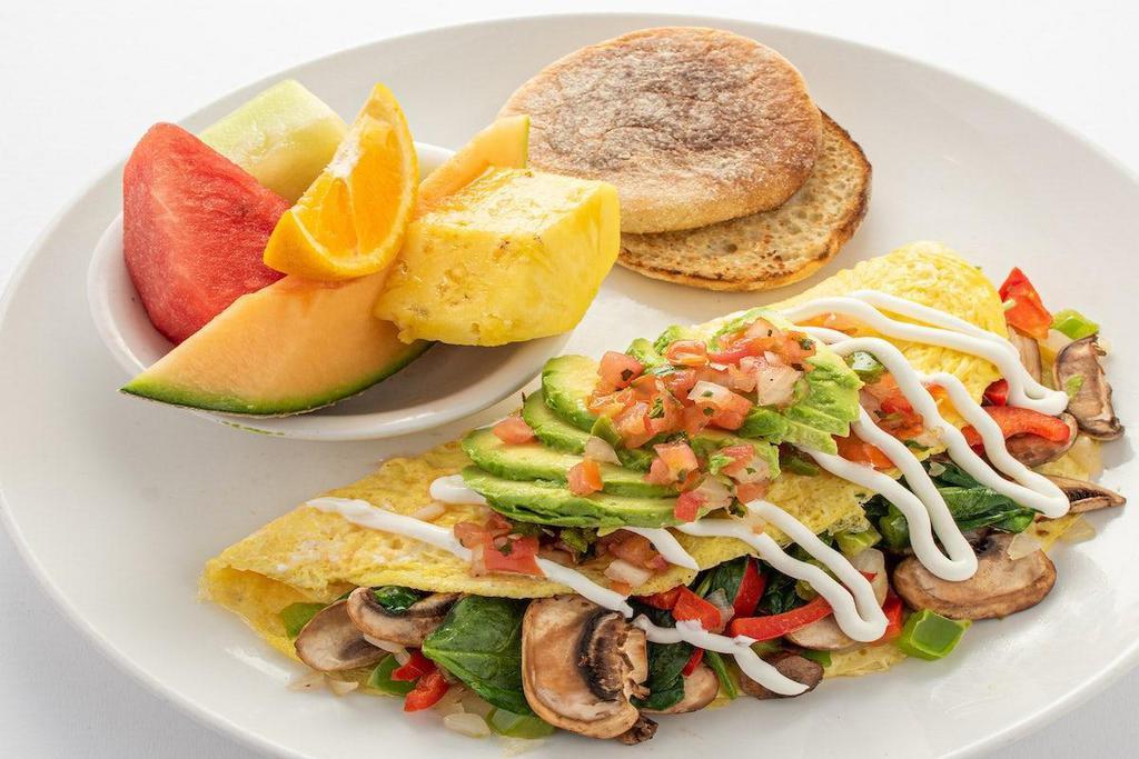The Mom Omelet · Spinach, mushroom, onion, red and green bell pepper.  Topped with avocado, salsa fresca and sour cream.