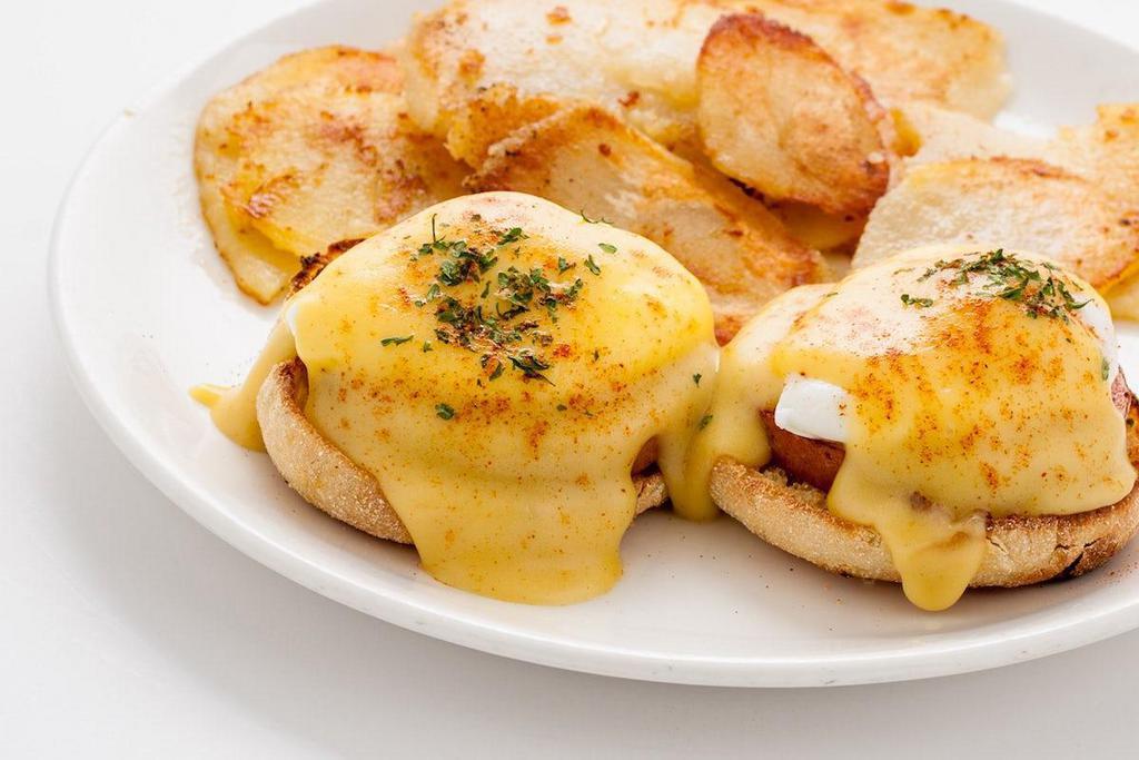 Classic Eggs Benedict · A toasted English muffin topped with Canadian bacon, poached eggs and hollandaise sauce.