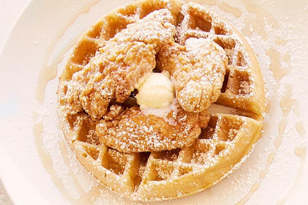 Chicken & Waffles  · Crispy chicken tenders served on a Belgian waffle with powdered sugar, syrup drizzle and whipped butter.