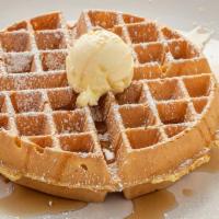 Belgian Waffle · A golden brown Belgian waffle sprinkled with powdered sugar and served with whipped butter.