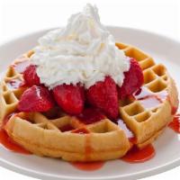 Strawberry Or Banana Belgian Waffle · A golden brown Belgian waffle sprinkled with powdered sugar and served with your choice of s...