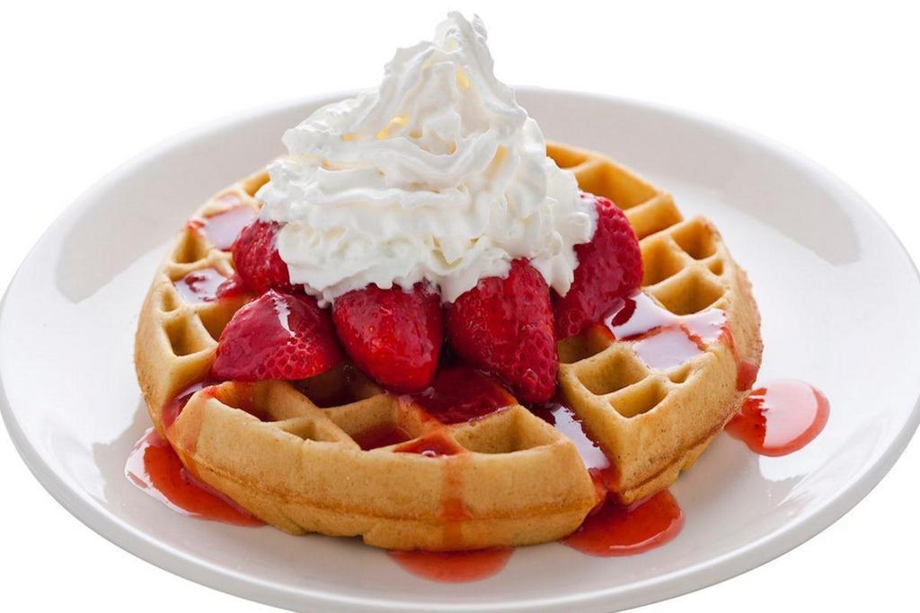 Strawberry Or Banana Belgian Waffle · A golden brown Belgian waffle sprinkled with powdered sugar and served with your choice of strawberries or bananas and whipped cream.