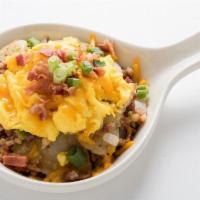 Hash Skillet · Homefried potatoes sauteed with corned beef hash, onions and bell peppers.  Topped with scra...
