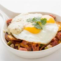 Country Skillet · Homefried potatoes sauteed with diced ham, bell peppers and onions.  Topped with sunny side ...