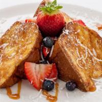 Tiki Toast · Three extra thick slices of sweet Hawaiian bread, grilled to a golden brown and topped with ...