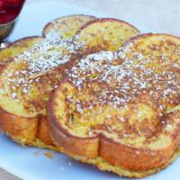 Classic French Toast · Three extra thick slices of bread, griddled to a golden brown, sprinkled with powdered sugar...